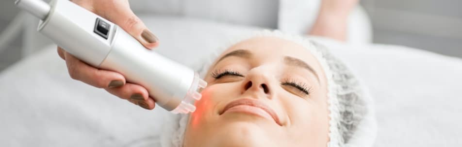 Woman getting facial laser treatment in Sarasota