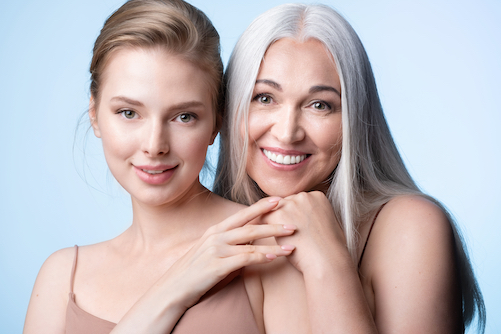 Two women who have clear skin and are happy with the results of Ultherapy