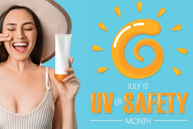 Beautiful young woman with sunscreen cream and text JULY IS UV SAFETY MONTH on blue background